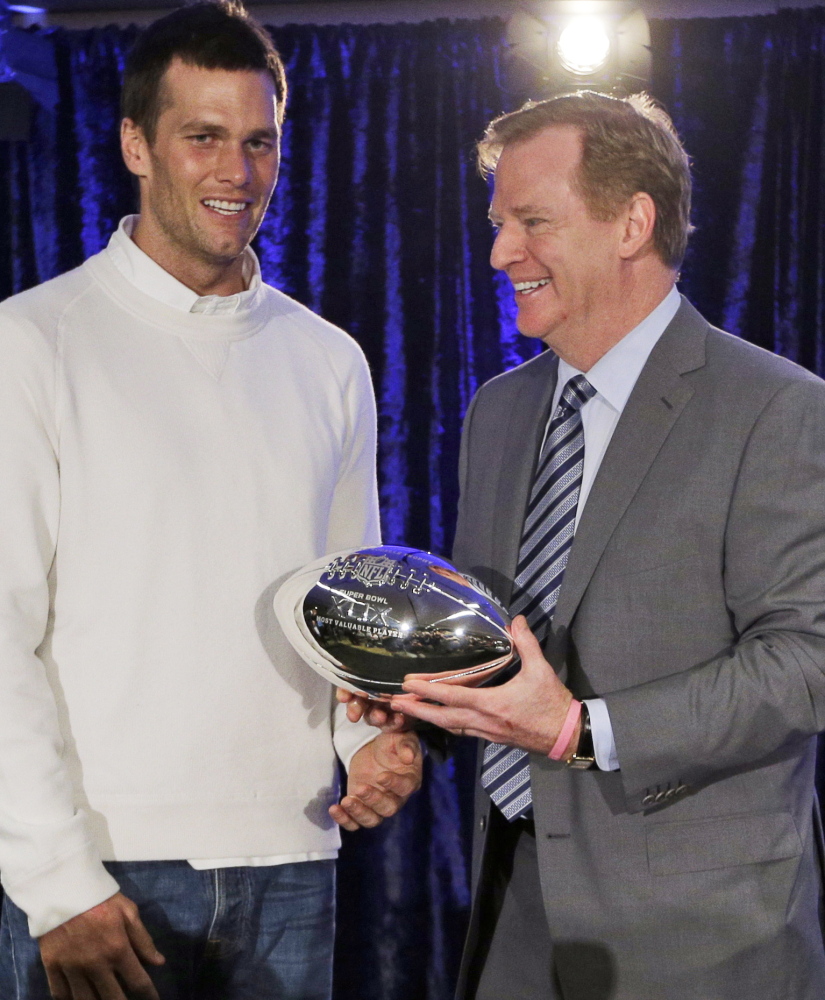 New England Patriots quarterback Tom Brady poses with NFL Commissioner Rodger Goodell during a news conference Feb. 2 after the Super Bowl XLIX in Phoenix.
The Associated Press