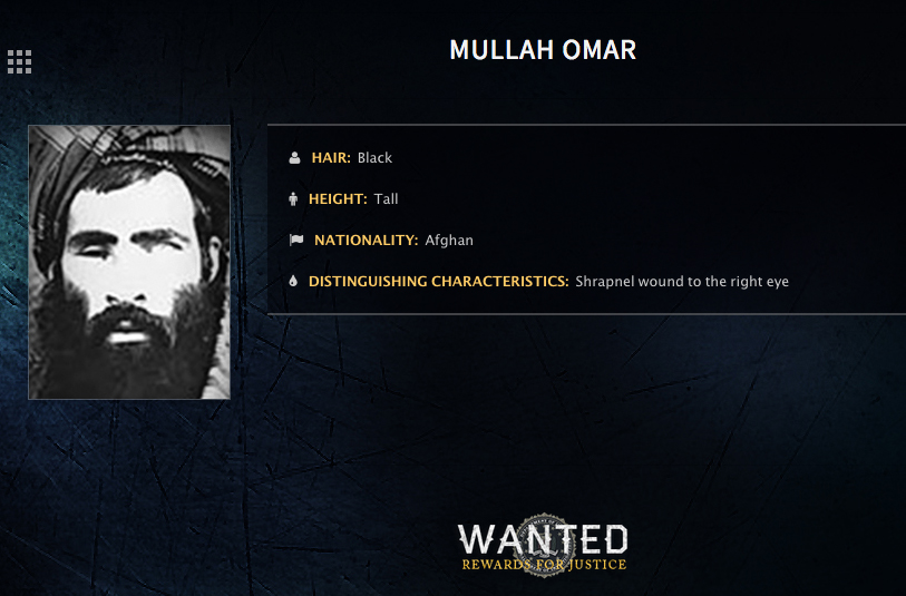 In this undated image released by the FBI, Mullah Omar is seen in a wanted poster. An Afghan official says his government is examining claims that reclusive Taliban leader Mullah Omar is dead.