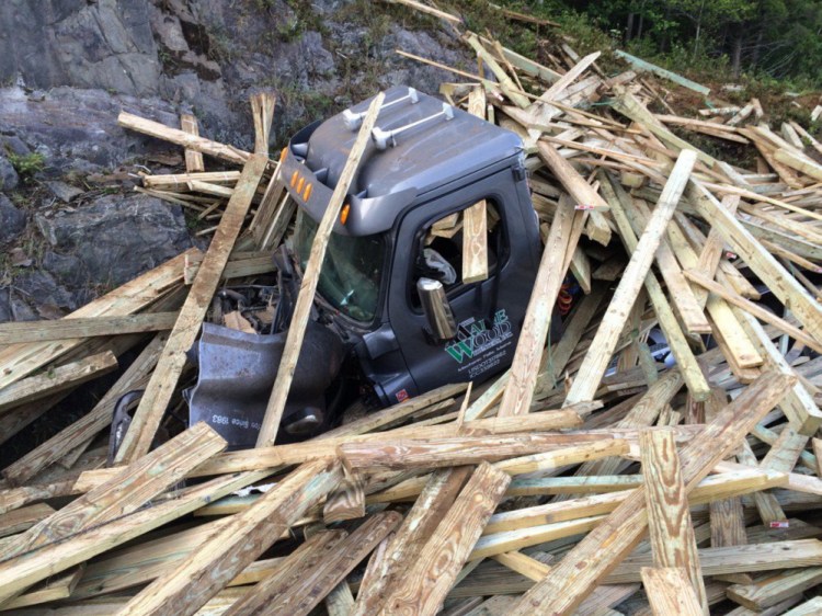 A tractor-trailer loaded with 90,000 pounds of lumber ran off Interstate 95 in Sidney at mile 115 in the northbound lane.