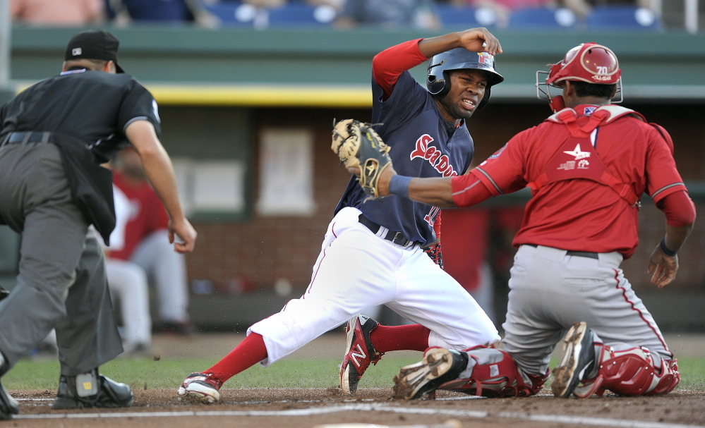 Manuel Margot of the Portland Sea Dogs gets thrown out at the plate as Harrisburg catcher Pedro Severino applies the tag Friday night during Harrisburg’s 9-4 victory at Hadlock Field. Margot was trying to score on a grounder by Sam Travis but was thrown out by pitcher Matt Purke.
