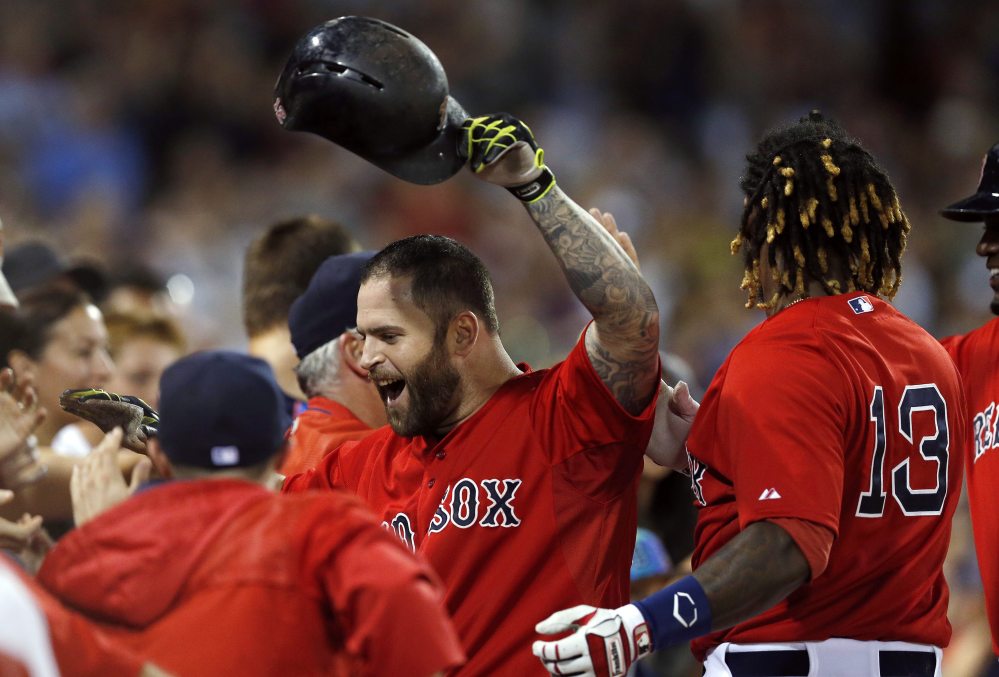 Mike Napoli celebrates his two-run home run in the seventh inning July 31, against the Tampa Bay Rays in Boston. 