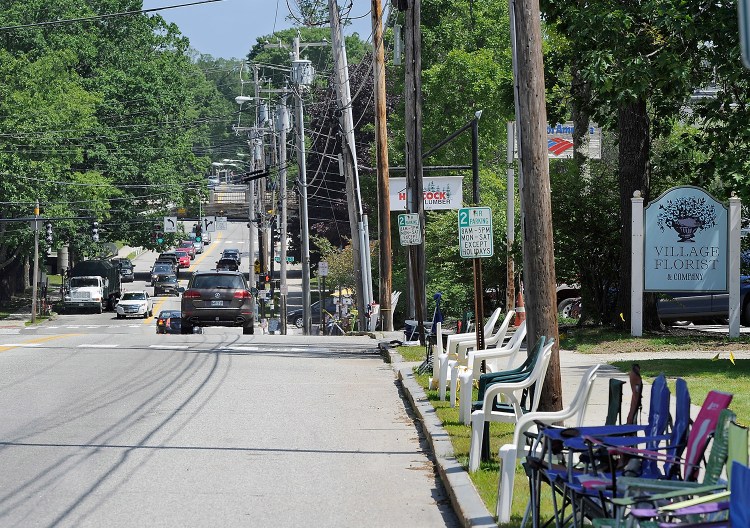 Chairs line Yarmouth's Main Street to save space for spectators at the Yarmouth Clam Festival parade. A replacement overpass will soon carry Route 1 over Main Street.
2015 Press Herald file photo/Gordon Chibroski