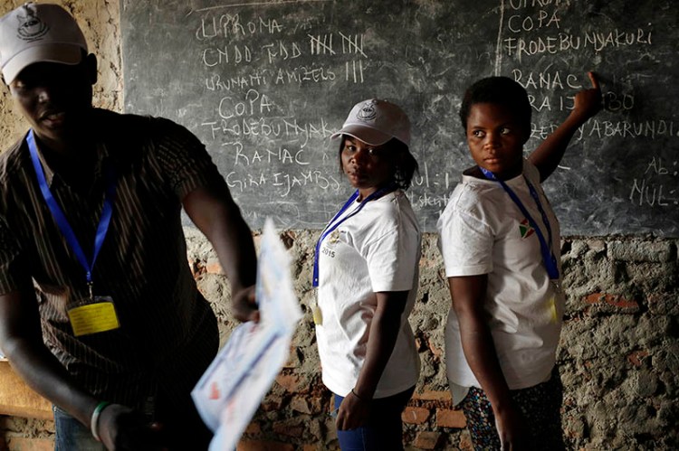 Election officials start counting the ballots after polls closed in the presidential elections in  Bujumbura, Burundi.