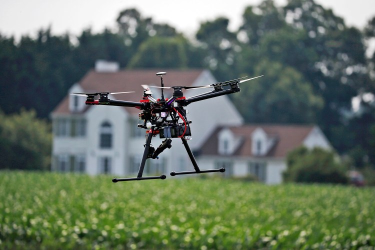 A hexacopter drone is flown by Intelligent UAS at a farm and winery in Cordova, Md., to demonstrate its agriculture potential for board members of the National Corn Growers. The Associated Press