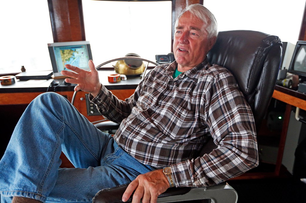 Glenn Robbins discusses the herring fishery aboard his boat, the Western Sea, in Rockland. He says  tighter restrictions on the herring catch could be necessary. Robert F. Bukaty / The Associated Press