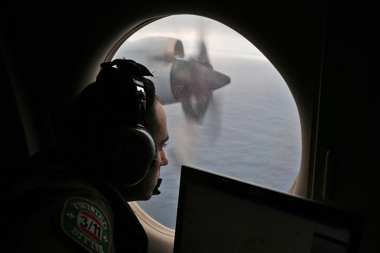 A flight officer aboard a Royal Australian Air Force AP-3C Orion searches for the missing Malaysia Airlines Flight MH370 in the southern Indian Ocean off Australia. Experts have identified debris as coming from the type of plane that went down.