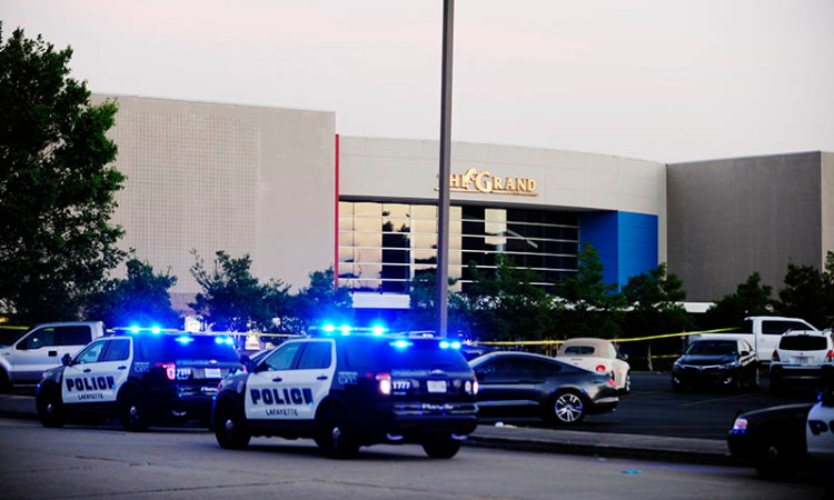 Law enforcement and other emergency personnel respond to the scene of the deadly shooting at the Grand Theatre in Lafayette, La. 