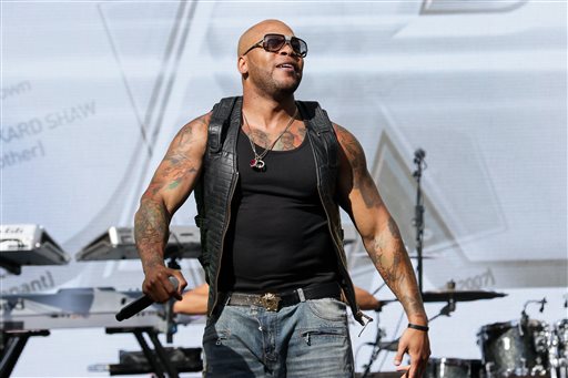 Flo Rida performs on stage in Los Angeles in this April 1, 2015, photo. The rapper has pulled out of his guest appearance at the "Miss USA" pageant scheduled for later this month in Baton Rouge, Louisiana. The Associated Press