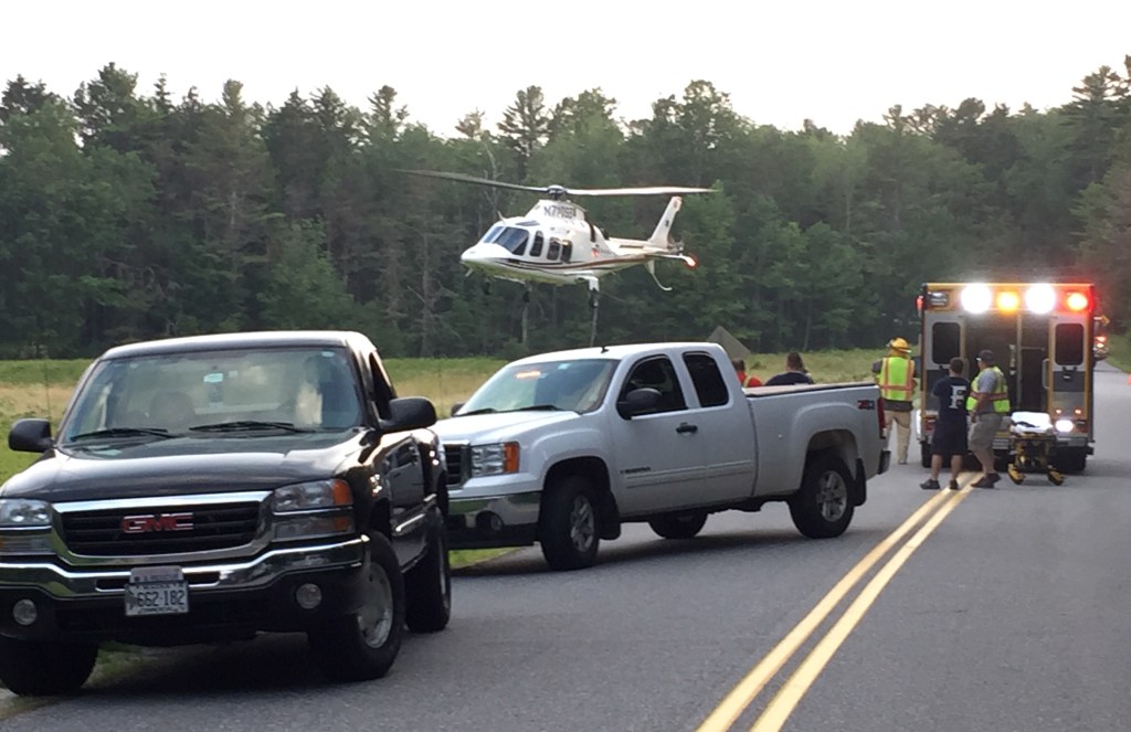 A LifeFlight helicopter carrying an injured motocyclist takes off from Flying Point Road in Freeport. Sarah Woodard photo