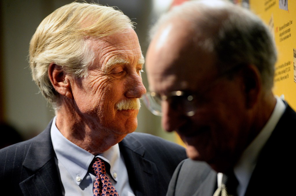 U.S. Sen. Angus King, left, and former Sen. George Mitchell wait to be introduced at the University of Southern Maine in Portland where they participated in a forum discussion about the Iran nuclear deal Wednesday.