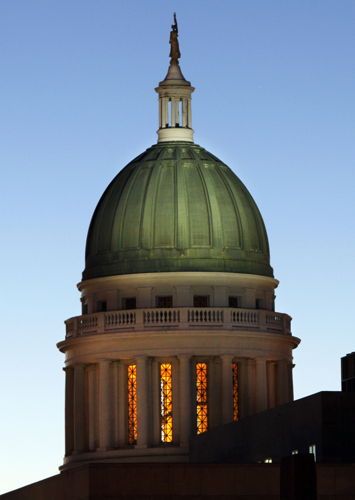 The old copper dome of the State House had a green hue after a century of exposure to the weather. Some of the old copper may be available to the public as soon as next month and plans are underway to construct a sculpture with the copper somewhere on the capitol grounds in Augusta. 2011 Associated Press File Photo/Robert F. Bukaty