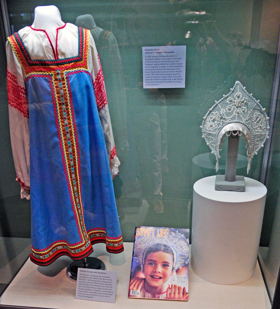 A traditional dress, called a sarafan, and headdress worn by Samantha Smith on her trip to the Soviet Union are on display at the Maine State Museum in Augusta. The Museum will also exhibit photographs from Smith's 1983 visit to Soviet Union. 