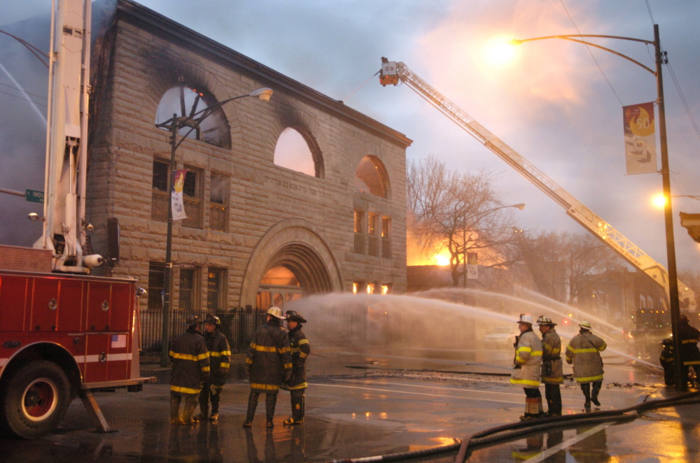 Chicago firefighters battle a major fire at Pilgrim Baptist Church, a treasured landmark designed by Louis Sullivan, in 2006. Plans to restore the church have stalled for nearly 10 years, fueling frustation in the community.