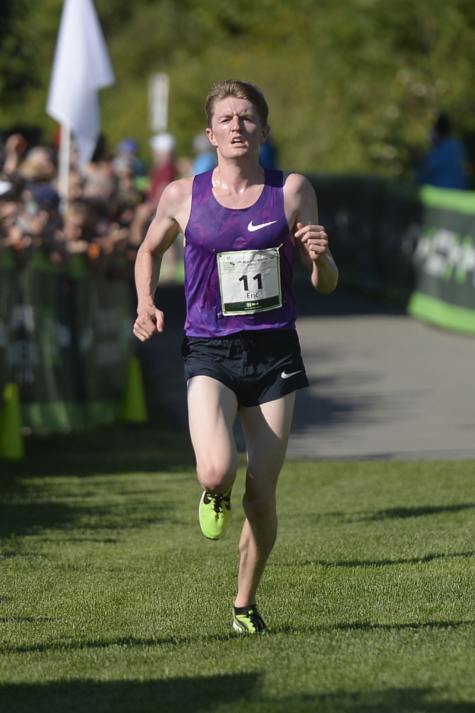 Eric Jenkins is the first American to cross the finish line of the TD Beach to Beacon 10K on saturday.