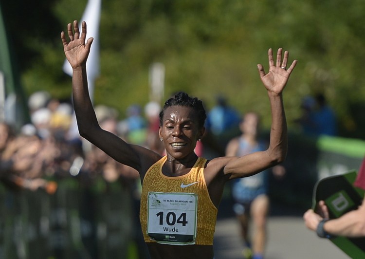 Wude Ayalew of Ethiopia is the fist female to cross the finish line of Saturday’s Beach to Beacon 10K.