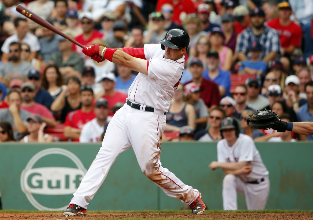 Boston Red Sox’s Travis Shaw follows through on his second home run  against the Tampa Bay Rays during the eighth inning at Fenway Park in Boston Saturday.