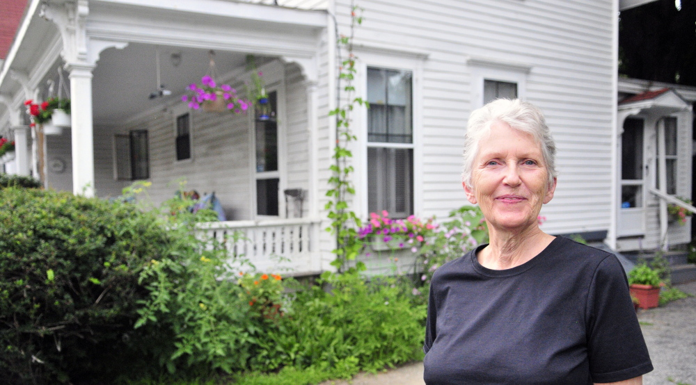 Shelia Stratton lives with her husband, Don Stratton, in an Augusta house that was built in 1850. The Strattons worry about restrictions that might come if a historic district is established.