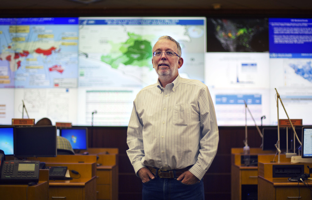 Martin Meltzer stands in the Emergency Operations Center at the Centers for Disease Control and Prevention in Atlanta. His worst-case model of the Ebola epidemic predicted far more cases than actually occurred but he is unbowed by critics who say he cried wolf.