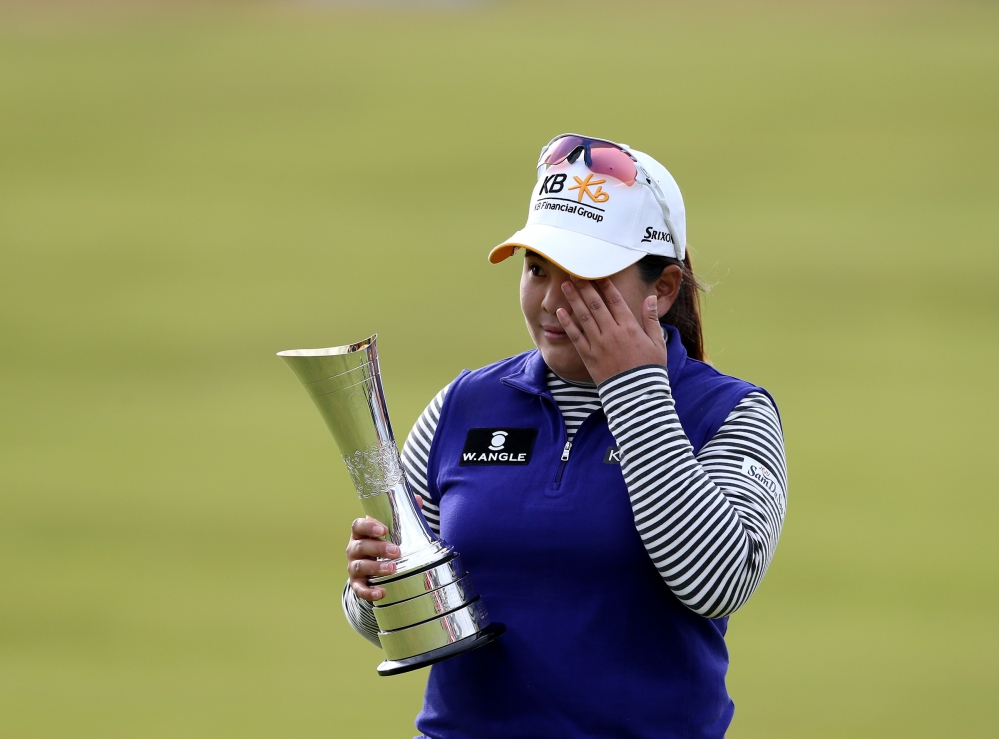 Inbee Park poses with the trophy after winning the Women’s British Open golf championship at the Turnberry golf course in Turnberry, Scotland, on Sunday.