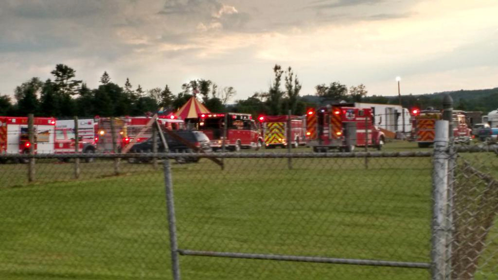 Officers surround the scene of a tent collapse in Lancaster, N.H., on Monday evening. Authorities say the circus tent collapsed when a severe storm hit the fairground.