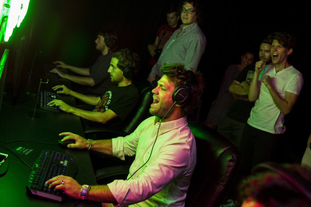 Zefr co-founder and co-CEO Zach James, center, gets into the action during an internal tournament playing the video game “Unreal Tournament” in Venice, Calif. 
Jay L. Clendenin/Los Angeles Times