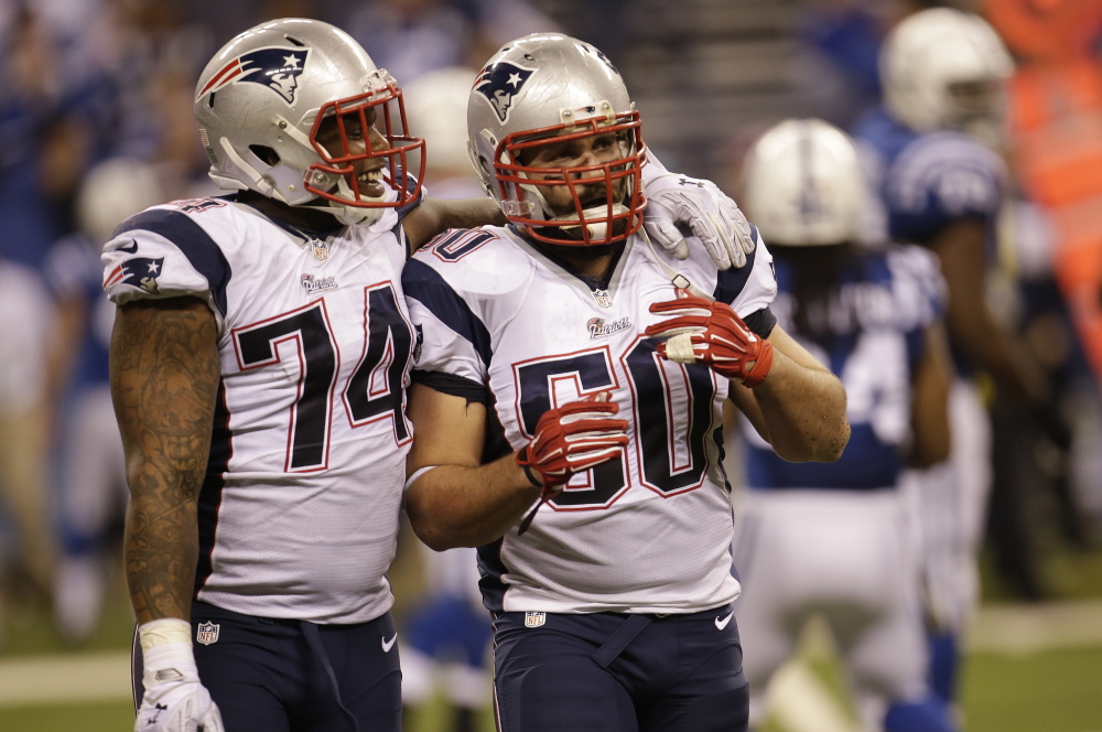 Patriots defensive ends Dominique Easley, left, and Rob Ninkovich celebrate a touchdown against the Colts last November. Easley was shut down late in the season to get healthy.