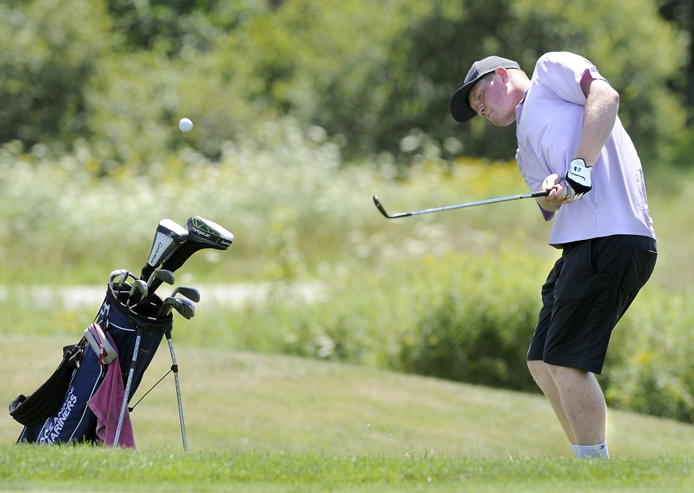 Nick Mazurek of Rockport chips to within two feet on the 18th hole after going out of bounds to card a seven on the final hole, but Mazurek still shot a 71 for the lead after one round at the Maine Junior Amateur Championship at Toddy Brook Golf course in North Yarmouth.