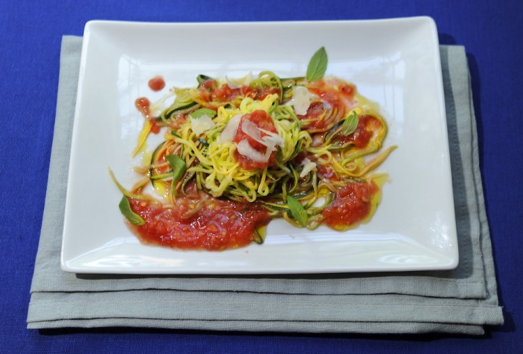 Zucchini noodles with raw tomato sauce offers satisfying heat-free dining.