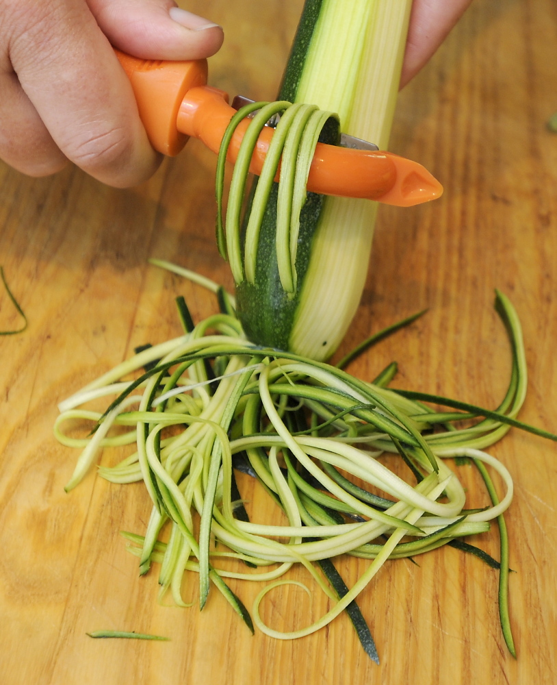 A julienne peeler makes short work of turning zucchini into “pasta.”