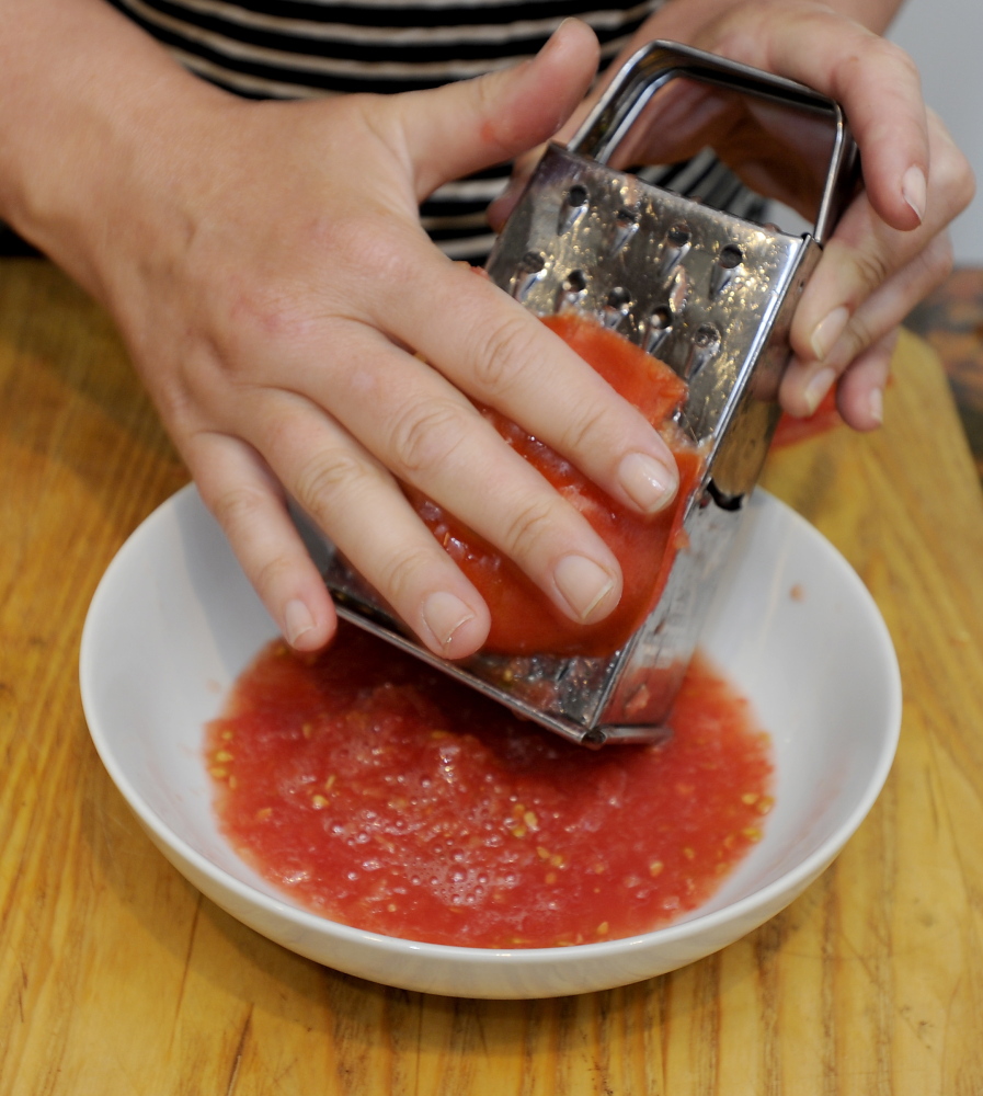 Grated tomatoes go into a raw tomato sauce to accompany zucchini pasta.