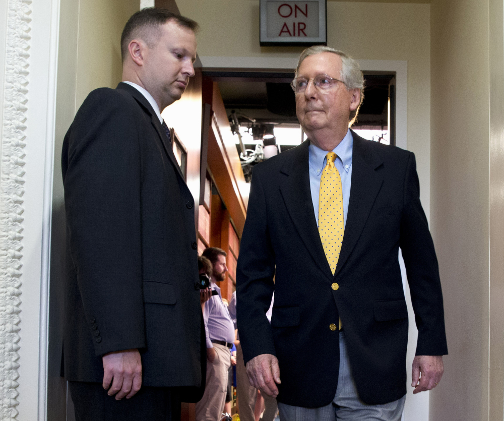 Senate Majority Leader Mitch McConnell leaves a news conference on Capitol Hill in Washington on Thursday. The Senate left Wednesday for an almost five-week vacation.