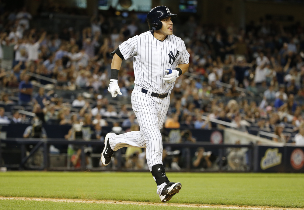 The Yankees’ Jacoby Ellsbury watches his seventh-inning solo home run, which proved to be the game winner Thursday night against the Red Sox.