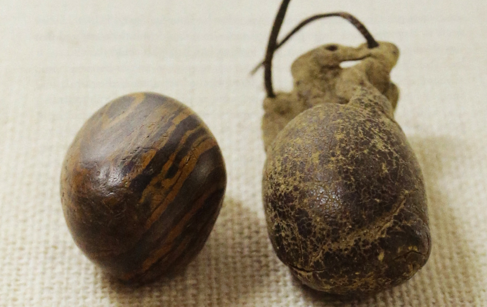 The Mormon church recently released photographs of the smooth stone that founder Joseph Smith is believed to have used in creating the Book of Mormon – part of a church effort to reveal artifacts from its history. At right is a weathered leather storage pouch  that is believed to have been made by Emma Smith, one of Joseph Smith’s wives. 
