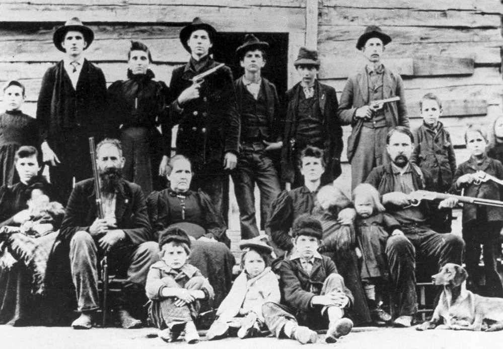 The  Hatfield clan poses in April 1897 at a logging camp in southern West Virginia.  The most infamous feud in American folklore, the long-running battle between the Hatfields and McCoys,