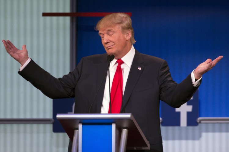 Donald Trump gestures during the first Republican presidential debate, at the Quicken Loans Arena Thursday in Cleveland.