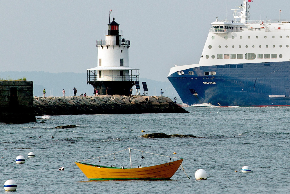 The Nova Star ferry dwarfs fishermen and tourists as it passes by Spring Point Ledge Light on its way to the Ocean Gateway terminal. The Portland-to-Yarmouth, Nova Scotia, service had lighter than expected passenger numbers for July, Nova Star Cruises reported last week, and authorities say it will not reach its goal of carrying 80,000 passengers this season. The ferry company also announced plans for an English Channel run over the winter, but the deal may have to be adjusted after an English port raised objections to being part of a new ferry route.
Gabe Souza/Staff Photographer
