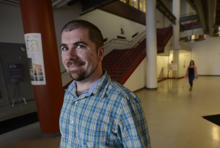 Todd Richard stands in the lobby of the Maine College of Art in Portland, which he will attend this fall. The tuition is daunting: He’s still paying off earlier student loans.