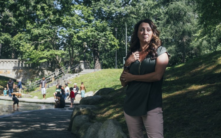 Laurie Bachelder stands near the wading pool in Deering Oaks, where a drug user collapsed near her family two weeks ago. Changed by the experience, she is volunteering to help with the drug problem, a response welcomed by the drug recovery community.