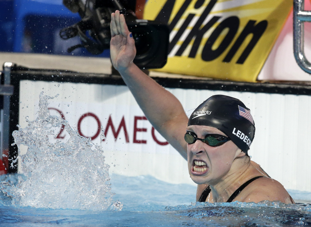 United States' Katie Ledecky celebrates after winning the women's 800m freestyle final at the Swimming World Championships in Kazan, Russia, Saturday, Aug. 8, 2015. (AP Photo/Michael Sohn)