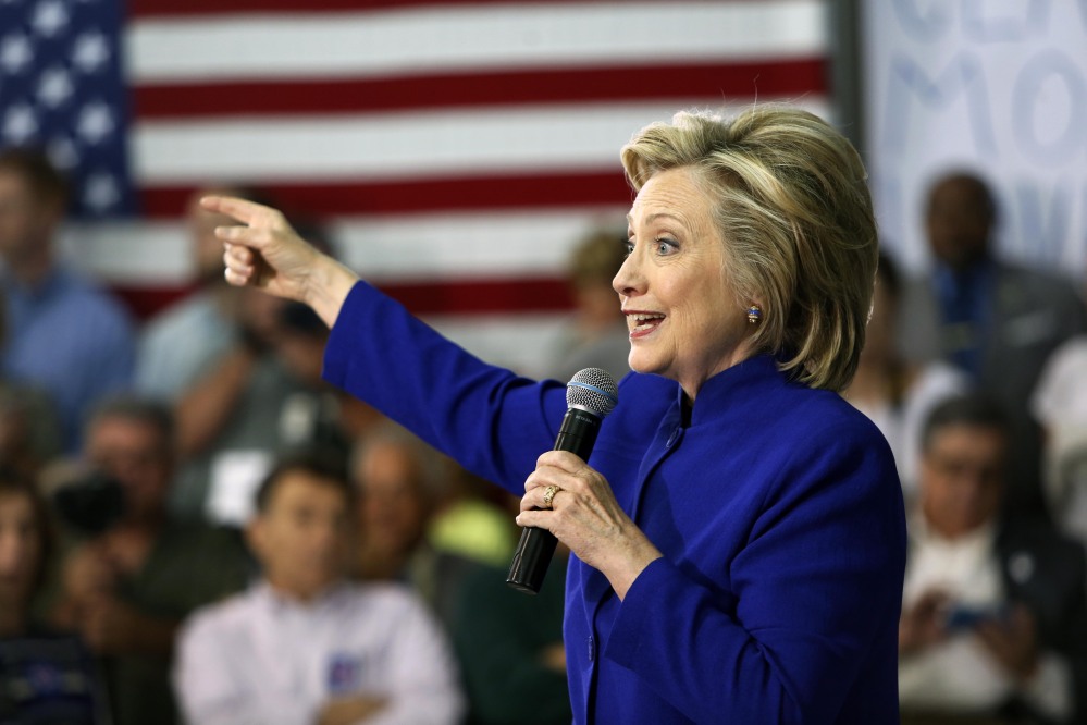 Hillary Clinton, seen speaking during a campaign stop Tuesday at River Valley Community College in Claremont, N.H., has “pledged to cooperate with the government’s security inquiry” into her private email account, according to her campaign spokesman.