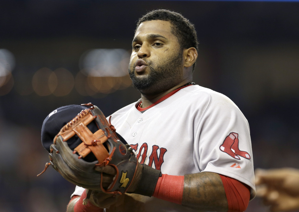 Red Sox third baseman Pablo Sandoval heads to the dugout at the end of the seventh the inning Wednesday in Miami, with his team on its way to a 14-6 loss.