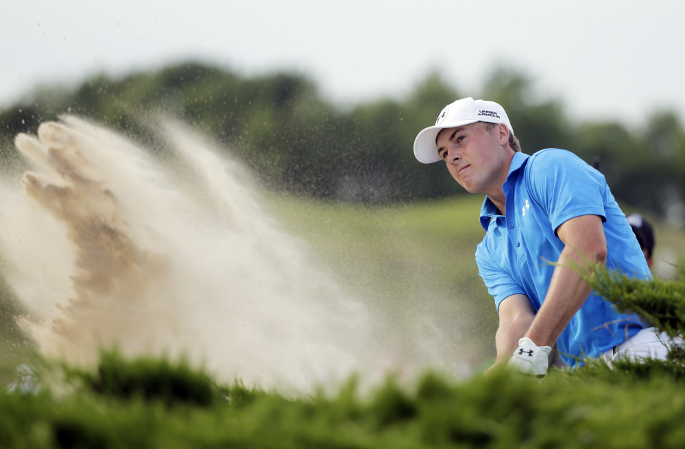 Jordan Spieth hits out of a bunker on the 15th hole at Whistling Straits. The Masters and U.S. Open champion finished with a 71, five shots off the lead.