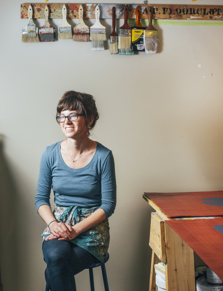 Floorcloth maker Addie Peet in her studio in Winterport.