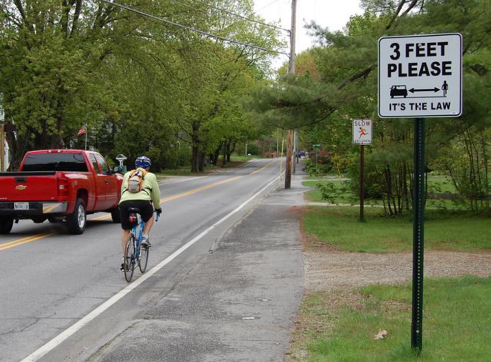 Signs in Brunswick notify motorists to give at least 3 feet of clearance when passing bicyclists. Courtesy photo