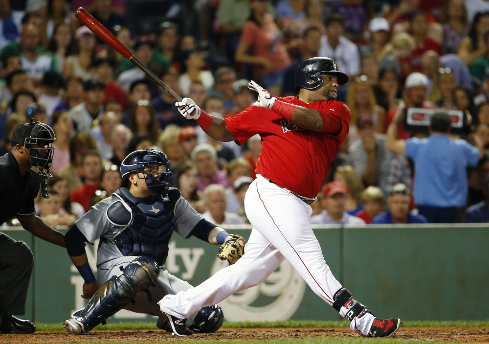 Boston’s Pablo Sandoval follows through on a two-run double in the third inning, when the Red Sox scored six runs and put the game away.