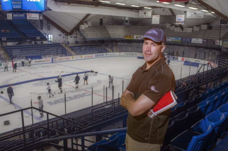 Ben Guite, a star on the Black Bears’ 1999 national championship hockey team and now assistant coach for the University of Maine squad, attends a skills development camp for young players at Alfond Arena in Orono. The second-year recruiter plays a lead role in finding talent for the school.