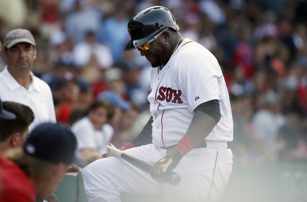Boston Red Sox's David Ortiz breaks his bat over his knee after striking out during the eleventh inning of a baseball gamea gainst the Seattle Mariners in Boston, Sunday, Aug. 16, 2015. (AP Photo/Michael Dwyer)