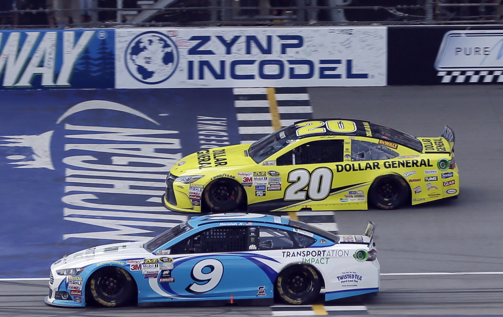 Matt Kenseth, top, didn’t quite lap Sam Hornish Jr. at the conclusion of the Sprint Cup race Sunday at Michigan International Speedway, but he did earn his third victory of the season.