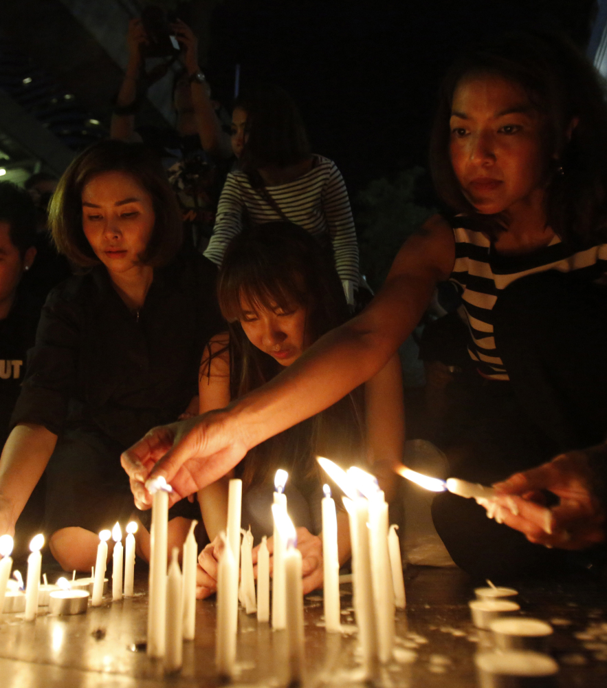 People light candles near the Erawan Shrine on Tuesday in Bangkok. Thai Prime Minister Prayuth Chan-ocha called Monday’s explosion “the worst incident that has ever happened in Thailand.”
The Associated Press