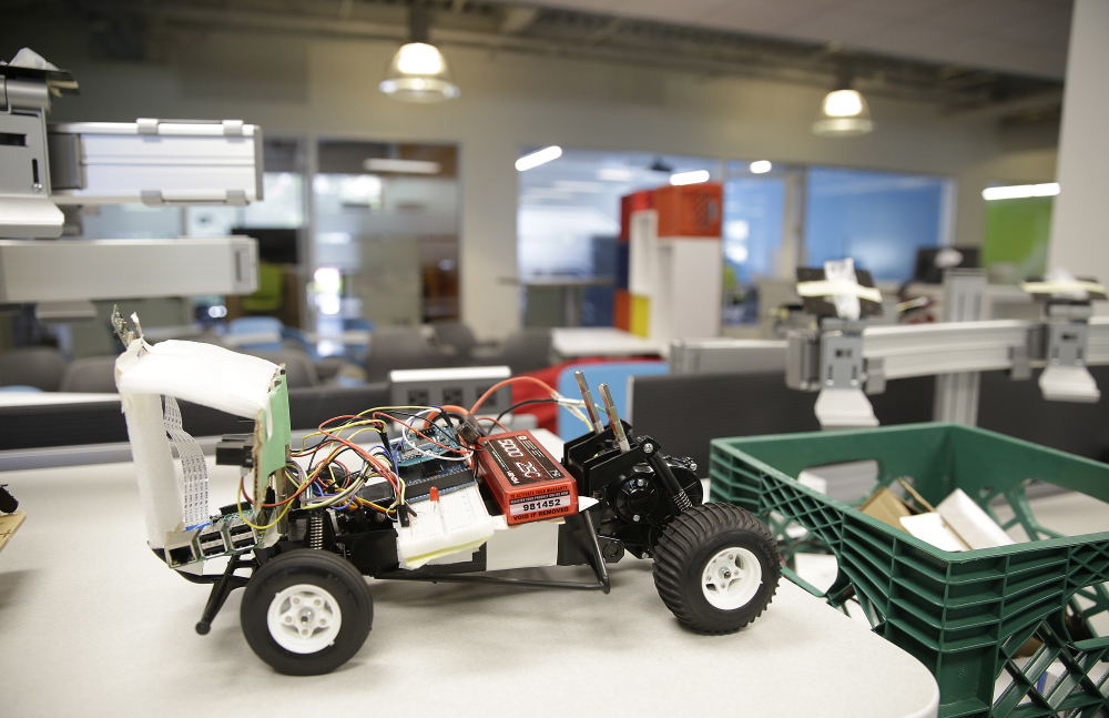 This remote-controlled car shows the upbeat atmosphere at Ford’s innovation center in Palo Alto. Software engineers enjoy the concrete application of their code that cars provide. (AP Photo/Eric Risberg)